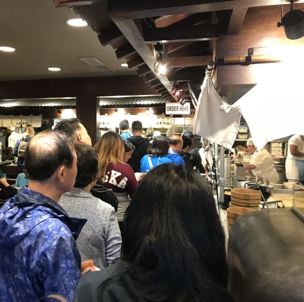 A line of customers waits to be served inside the Marukame Udon restaurant in Waikiki.