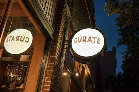 The sign outside Curate restaurant in Asheville, North Carolina.