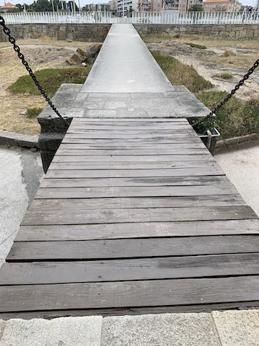 A photo of the walkway and drawbridge at Castel do Queijo in Porto, Portugal.