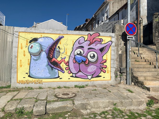 A cartoon mural created by Pedro Podre and Mesk (Gustavo Teixeira)in Porto.