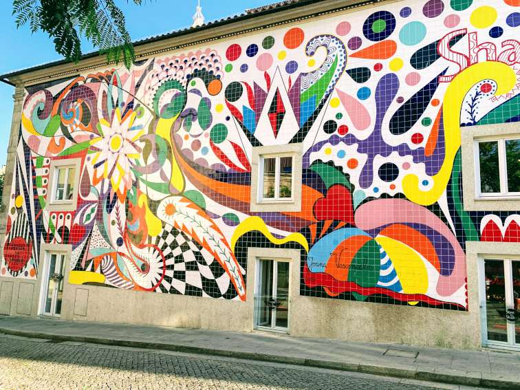 A large painted tile mural by Joana Vasconcelos on the Steak and Shake building in Porto, Portugal.