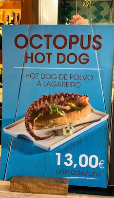 A placard advertising a lobster hot dog at the Time Out Market in Lisbon.