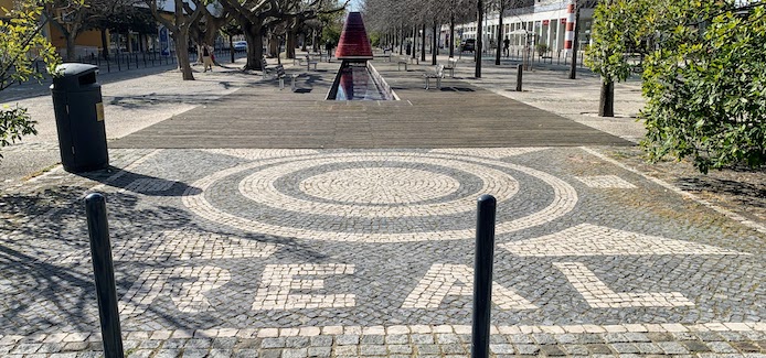 Cobblestones spelling "REAL" on Alameda dos Oceanos in Lisbon