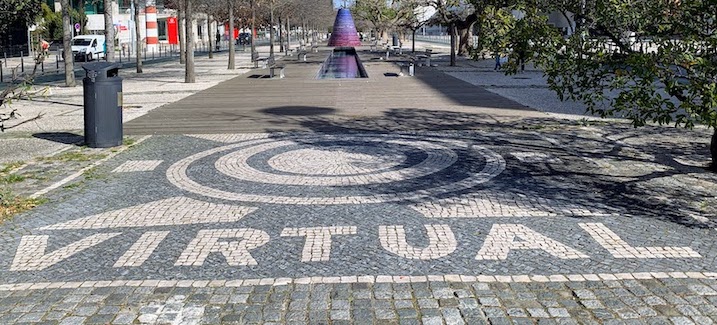 Cobblestones spelling "VIRTUAL" on Alameda dos Oceanos in Lisbon