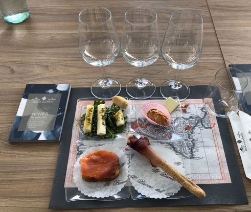 Food and glassware set out for wine tasting at Duca Di Salaparuta winery, Casteldaccia, Sicily.