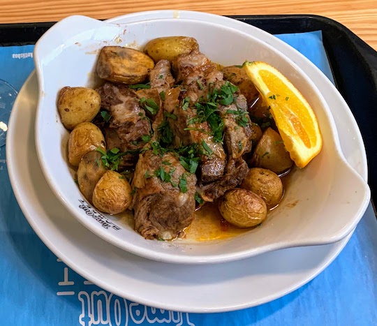 Roasted veal with baked potatoes at Marlene Vieira Kiosk in the Time Out Market in Lisbon.