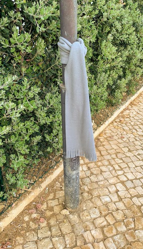 Mary's scarf tied to a post