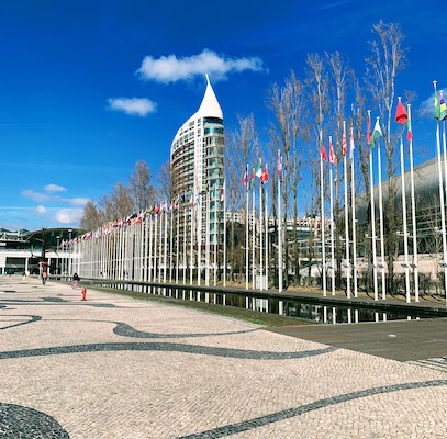 The reflecting pool and row of flags at the Rossio dos Olivais in Lisbon