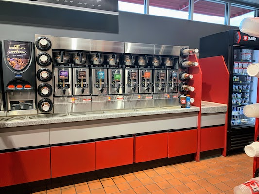 A large drink station in a convenience store with 10 varieties of coffee