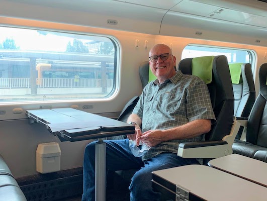 Mike sitting at the four top table on the Alfa Pendular.