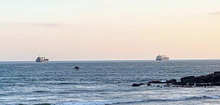 Two ships anchored off the Atlantic coast of Portugal near Lisbon