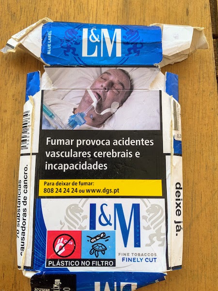 A Portuguese cigarette pack with the warning "Smoking causes strokes and disabilities"