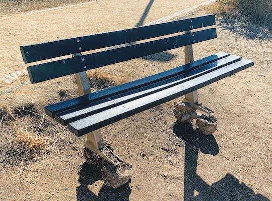 The "portable" bench along the path