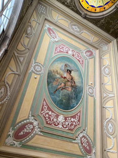 The painting above the stairway at Palácio Chiado