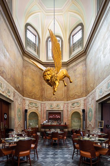 Marquis the Lion hanging above the small bar at the Palácio Chiado