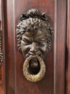 An ornate door handle at the Palácio Chiado