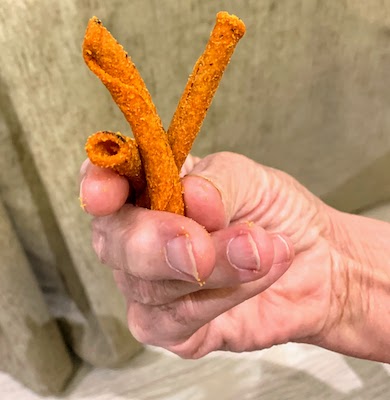 A handful of Takis snacks