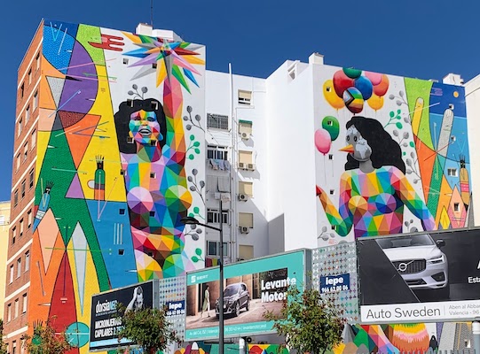 7171 - Mural Large murals of colorful women on a building across from the train station in Valencia, Spain.
