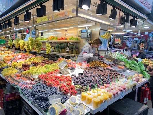 8847 - Fruit Vendor at Mercado A fruit vendor in the Mercado Central in Valencia.