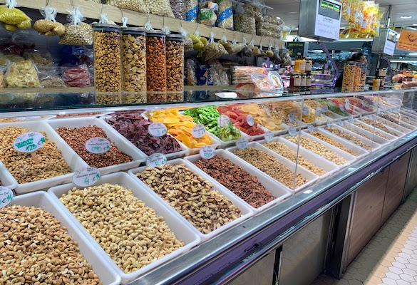 8849 - Nuts at the Mercado A long counter selling nuts at the Mercado Central in Valencia