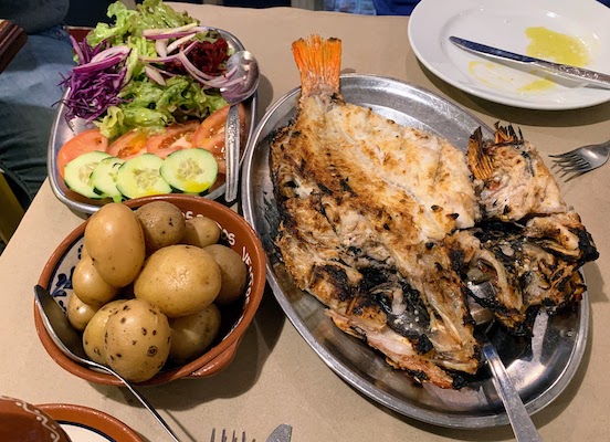 Grilled red snapper, boiled potatoes, and salad at Rosa dos Ventos in Nazaré.