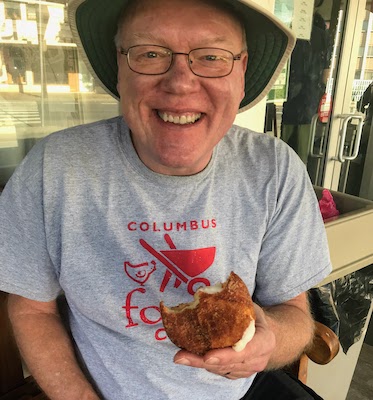 Mike eating a malasada at Leonard's Bakery in Honolulu, February, 2019.