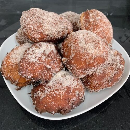 A plate of freshly cooked malasadas. Delicious!