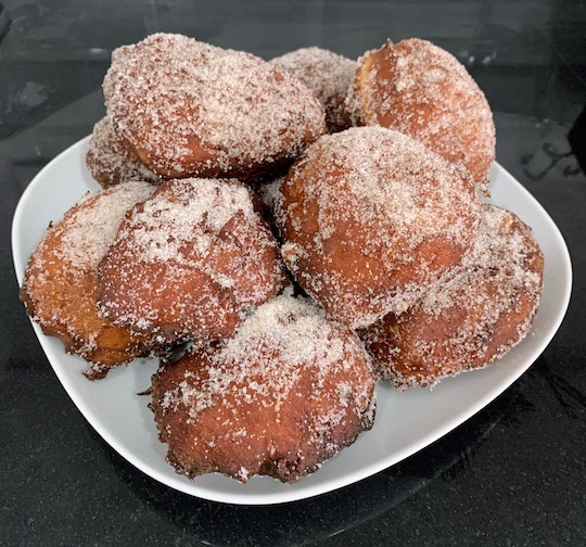 A plate of freshly cooked malasadas. Delicious!