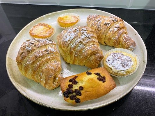 A plate of pastries from Pastelaria Luanda.