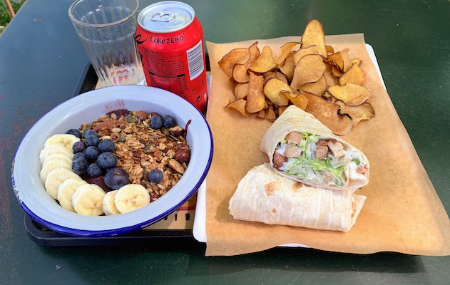 Our lunch at Bananacafé - Jardim da Estrela. An acai bowl, a chicken caesar wrap, some sweet potato fries, and a Coke Zero.