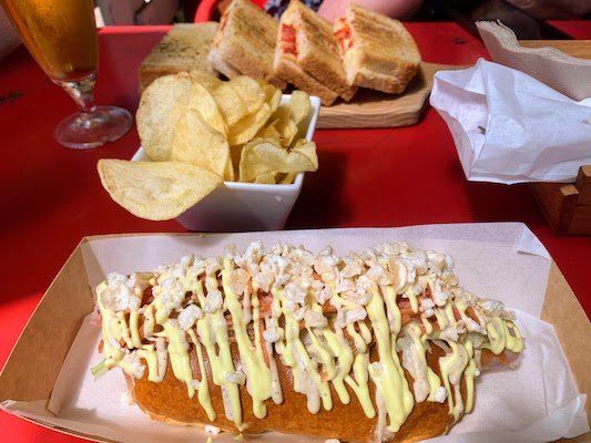 Our lunch at Quiosque do Mercado - an over-the-top hot dog and a tosta diavolo (panini with mozzarella and choriço).