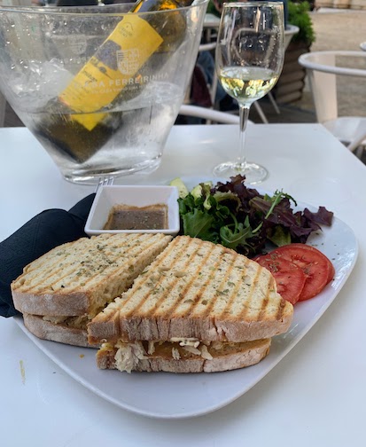 Our dinner at the kiosk in the Miradouro de São Pedro de Alcântara - a bottle of white wine and a large tosta, a grilled sandwich served with lettuce, tomato and oil & vinegar dressing.