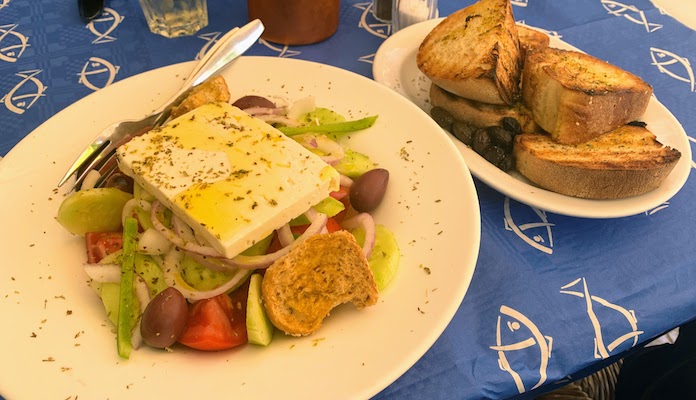 9818 - Greek salad A Greek salad ad bread at a restaurant in Hydra Town.