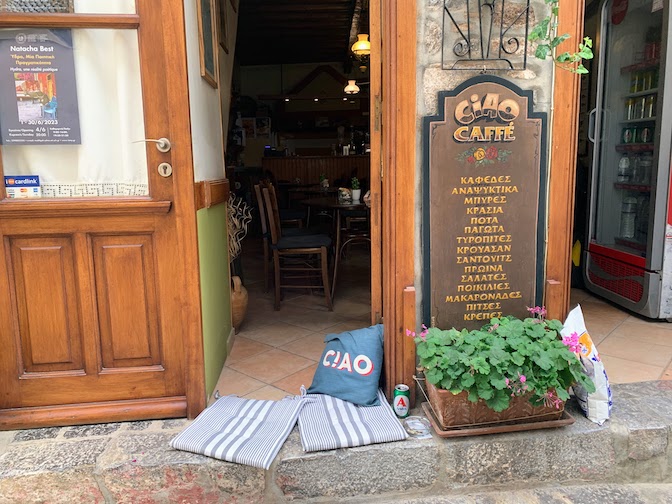 9828 - Cushions at the cafe A cafe in Hydra Town with cushions in a doorway to encourage patrons to sit and have a drink.