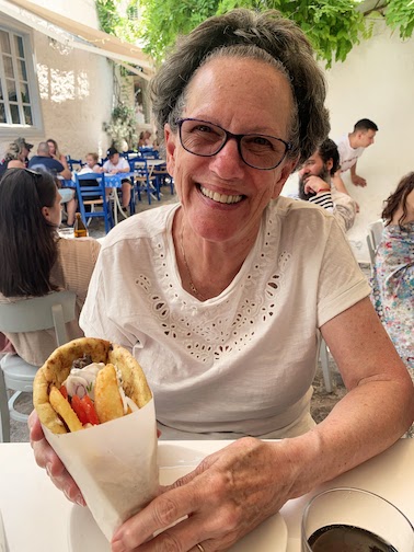 9869 - Mary and gyroi Mary enjoying a gyro at the Red Onion café in Hydra.