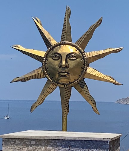 9871 - Sun sculpture A metal sculpture of the sun on the island of Hydra, Greece.