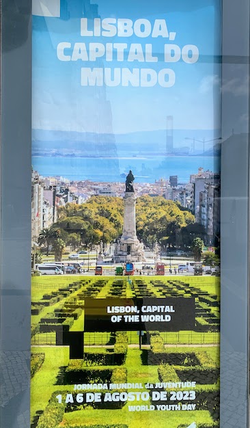 A poster adverstising World Youth Day proclaiming "Lisboa, Capital do Mundo" or "Lisbon, Capital of the World".