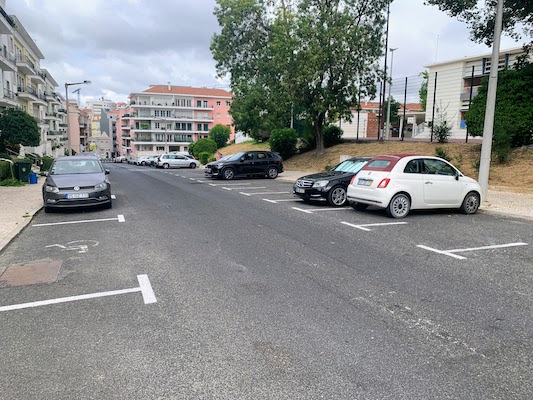 A picture of a street in our neighborhood that shows many empty parking spots.