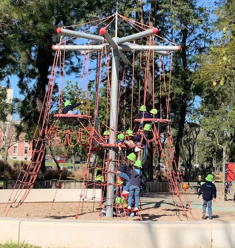 Children playing on a climbing apparatus in the playground at Jardim Mário Soares in Lisbon.