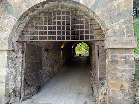 A postern, or entryway, through the wall. The inscription MDXLVIII suggests a date: 1548.