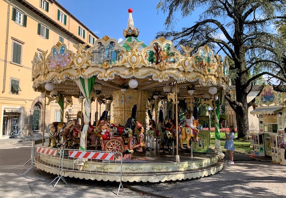 A colorfully decorated carousel in Lucca.