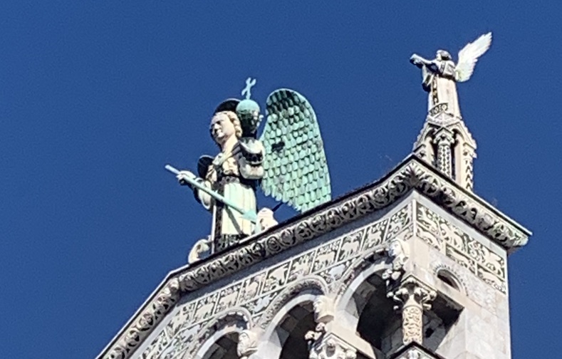 A closer view of the statue of Archangel Michael on top of the Chiesa de San Michele in Foro.