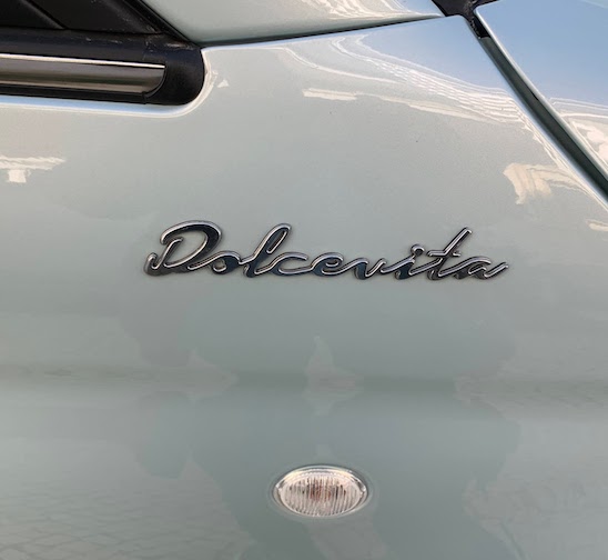 The badge on the Fiat - "Dolcevita" or "Sweet life".