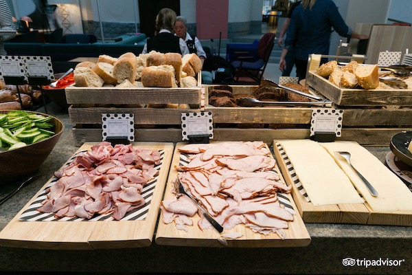 A breakfast buffet selection of meats, cheeses, and breads at a Swedish hotel.