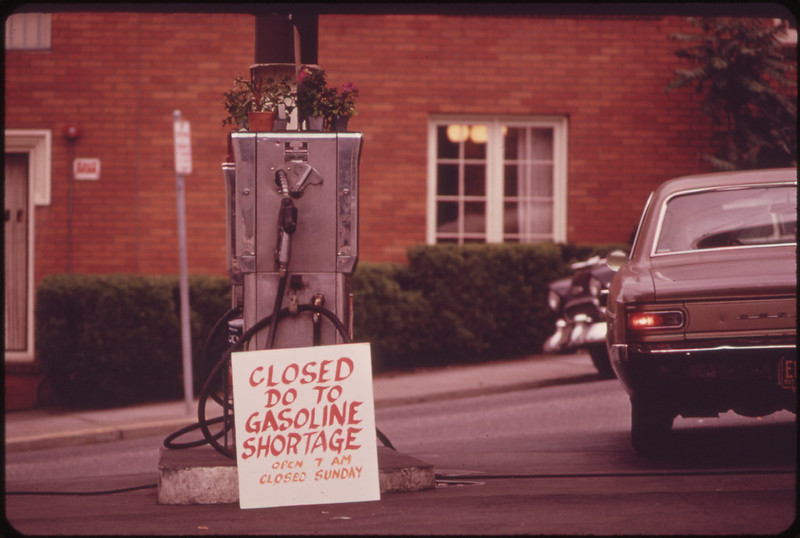 A photo from 1973 showing a sign next to a gasoline pump that reads "Closed do [sic] to gasoline shortage".