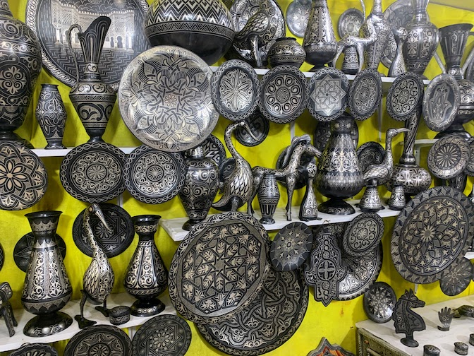 A display of damascene metalwork on sale in Meknes.