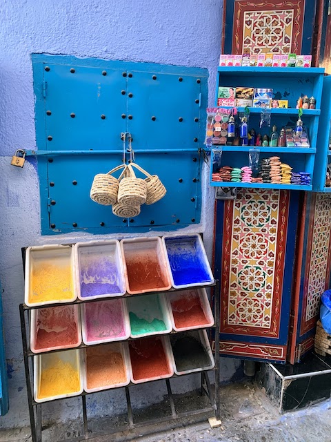 Colored powders for tinting paint on sale in Chefchaouen.