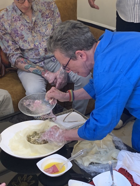 Mary adding ingredients to a pastilla we enjoyed in Fez.