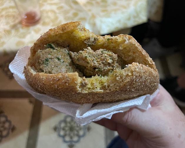 A camel burger on locally-made bread.