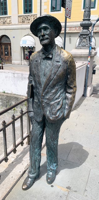 A statue of James Joyce on a walkway over the Grand Canal in Trieste.